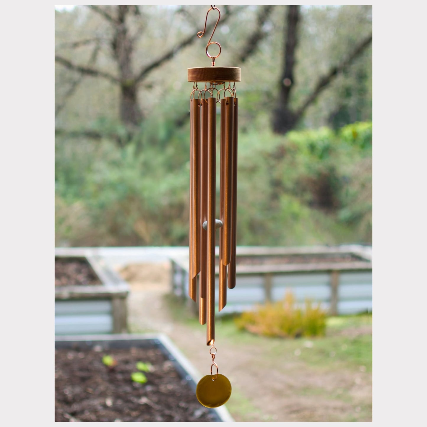Wind chime featuring seven genuine copper chimes and a brown beach glass windsail.