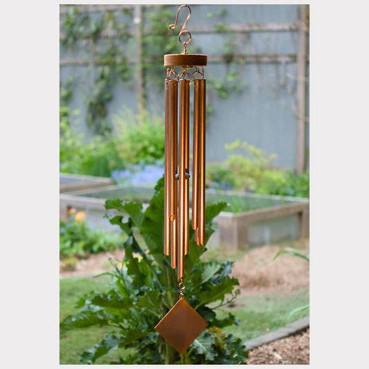 Handcrafted wind chime with eight copper chimes.