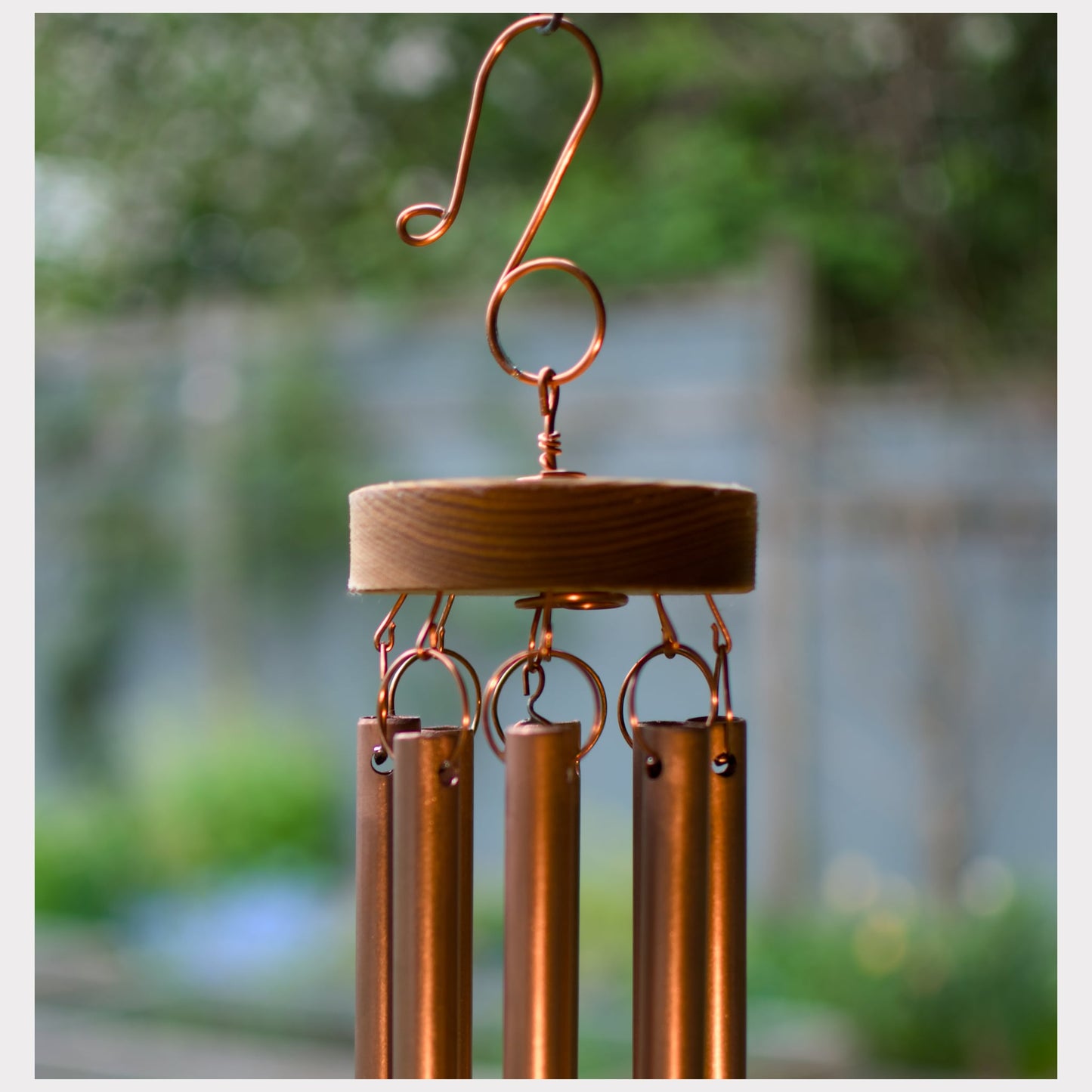 top of a copper wind chime, including a handcrafted copper hook