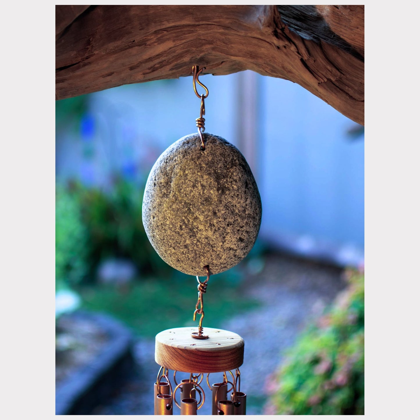 zoom detail, driftwood and beach stone wind chime