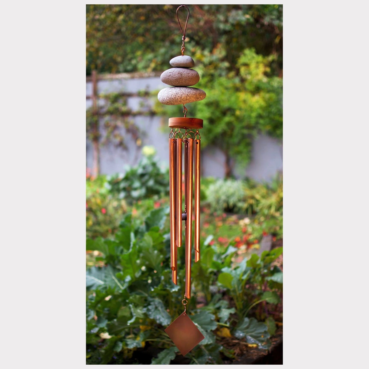 Zen beach stone wind chime with seven copper chimes.