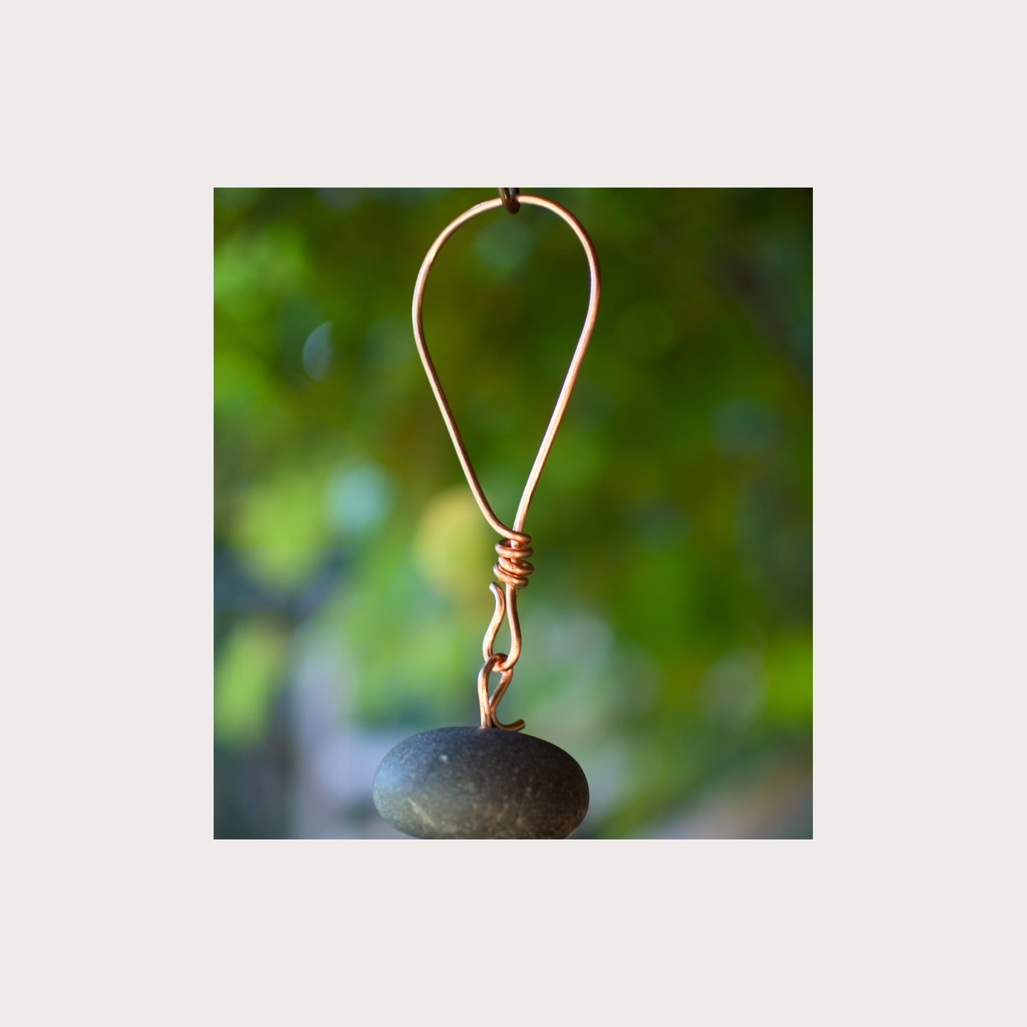 Handmade copper hanging loop for a large beach stone wind chime.