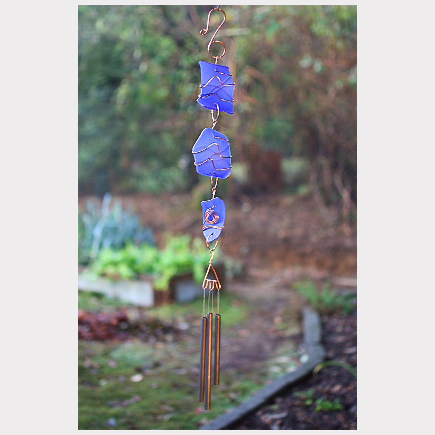 Cobalt blue glass wind chime with three antiqued brass chimes.