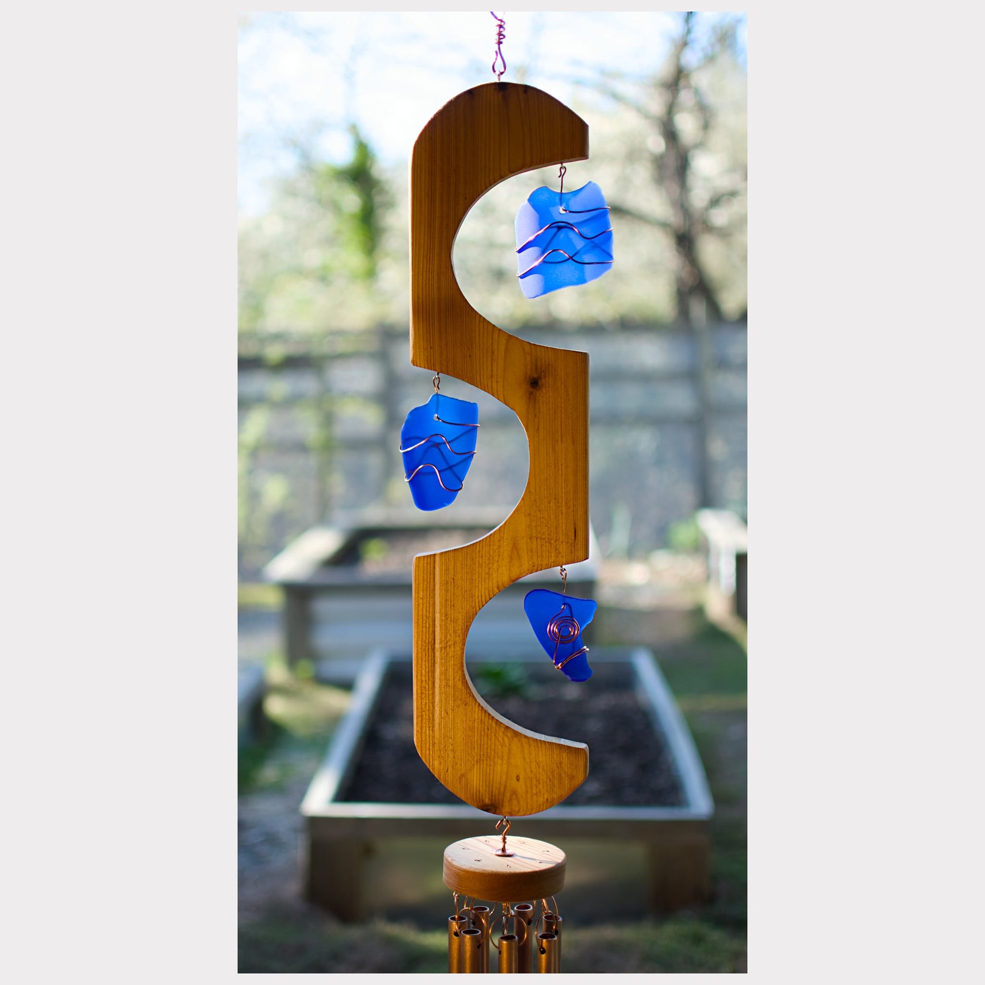 detail glass and cedar wind chime