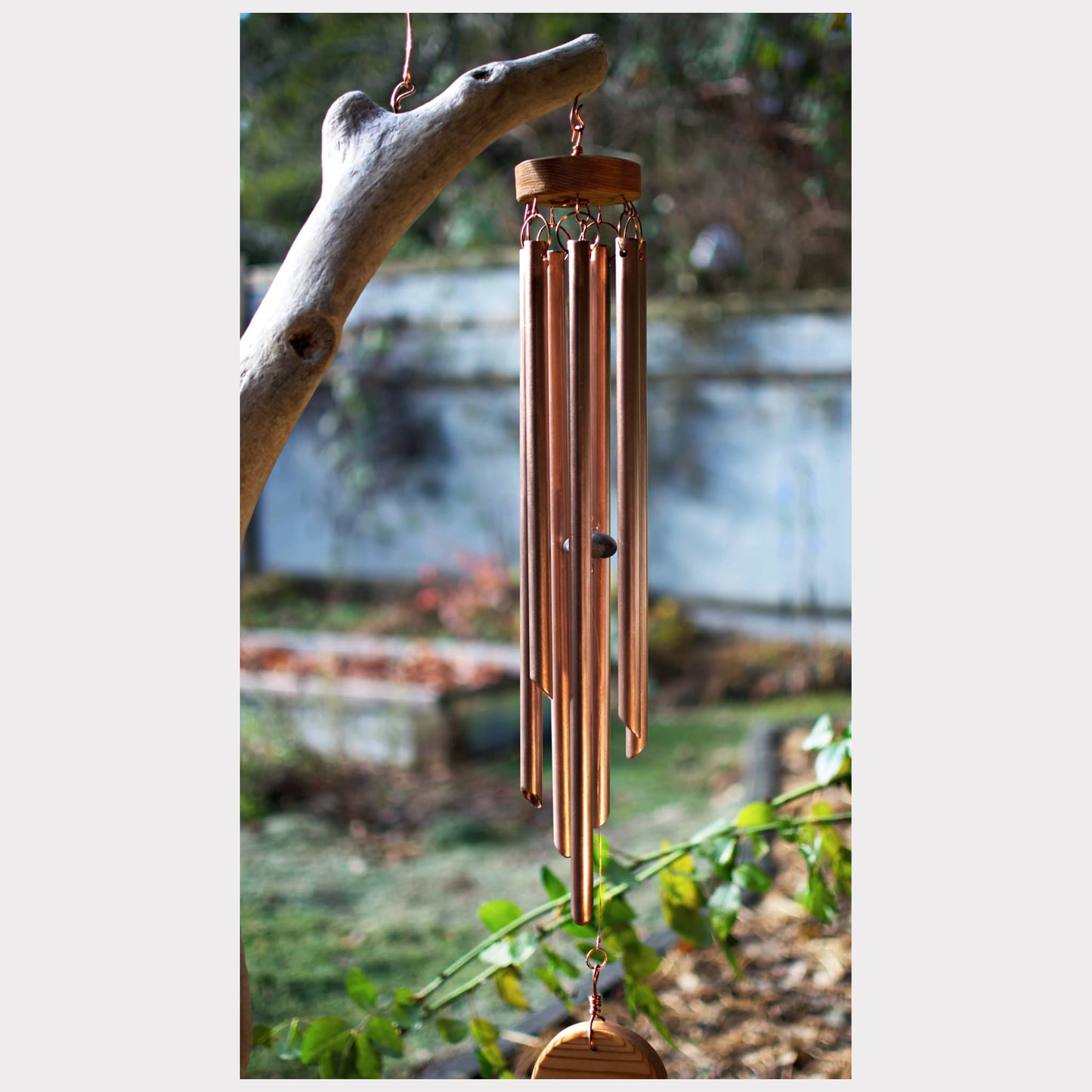 detail, driftwood and copper wind chime