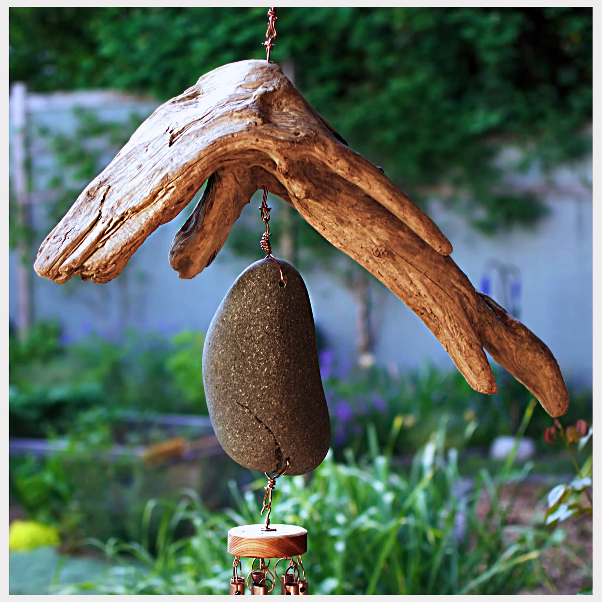 detail, driftwood and beach stone wind chime