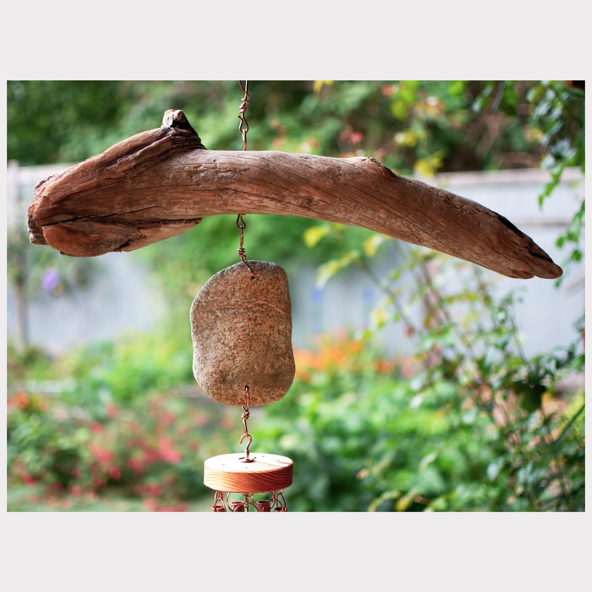 detail, driftwood and beach stone wind chime