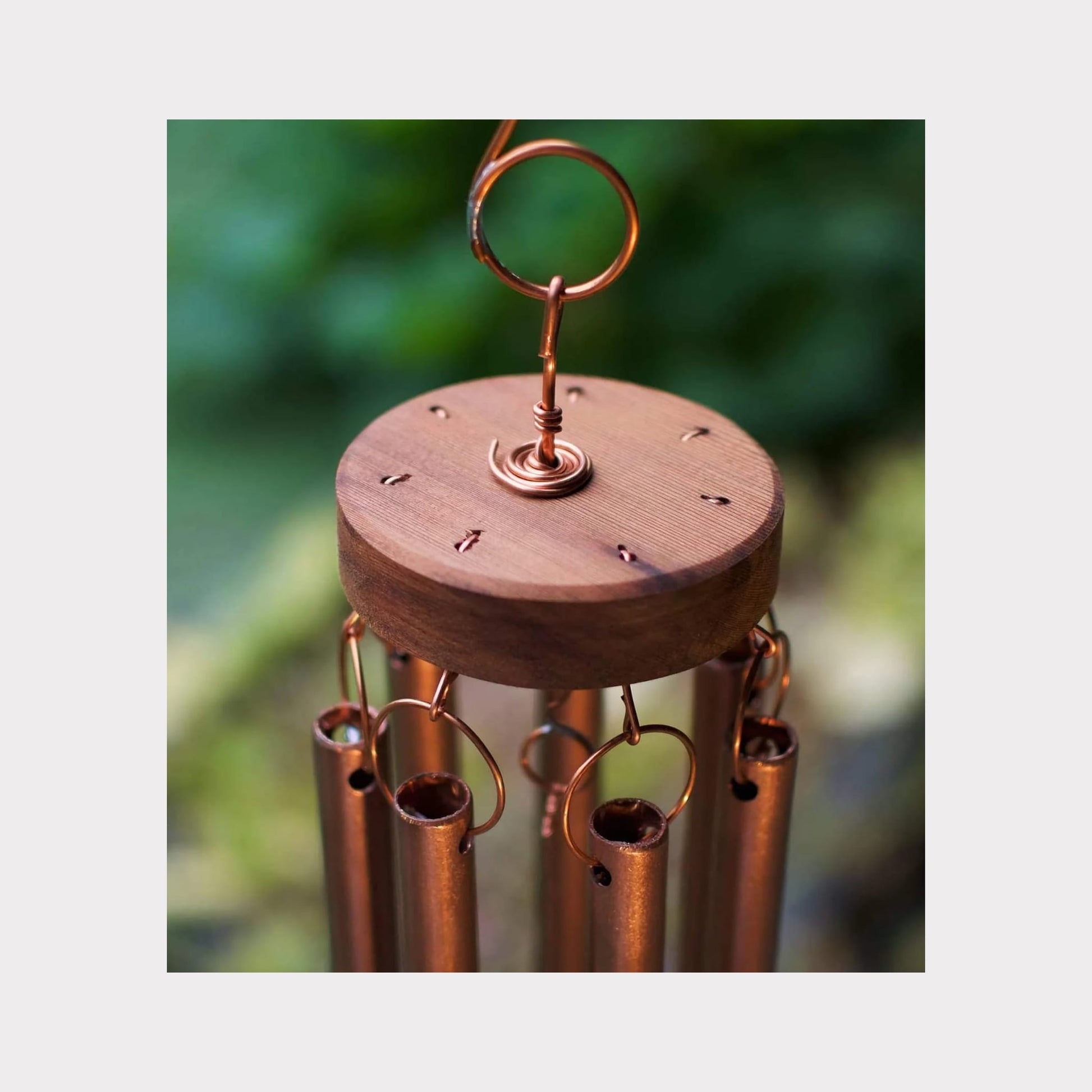 top of a handmade copper wind chime