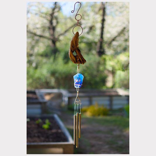 Driftwood wind chime featuring artist-made beach glass and three brass chimes.