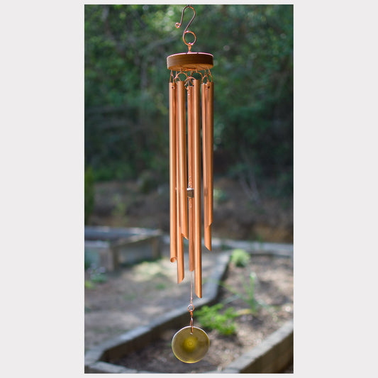 Handmade wind chime featuring 7 copper chimes and a glass windsail.