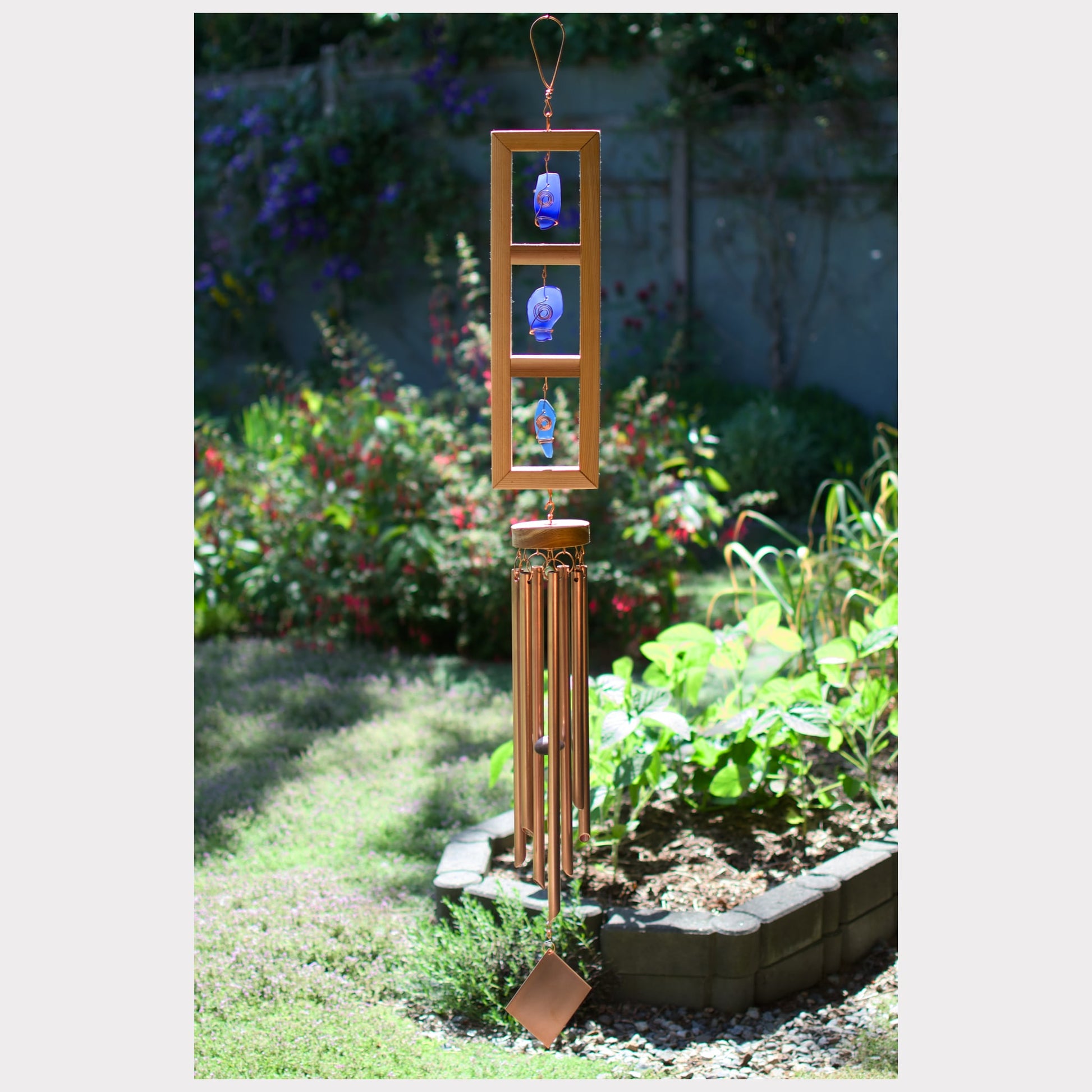 Cedar wind chime with cobalt blue sea glass and seven copper chimes.