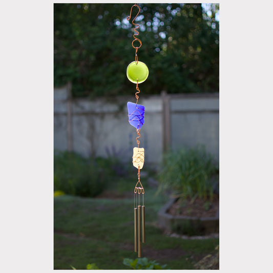 Sea glass wind chime with three brass chimes and a fancy hammered copper hook.