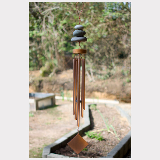Zen wind chime featuring three natural beach stones and five genuine copper chimes.