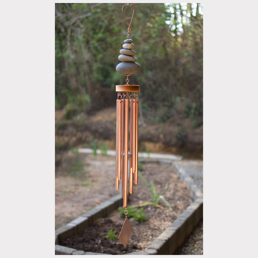 Zen wind chime featuring five natural beach stones and seven genuine copper chimes.
