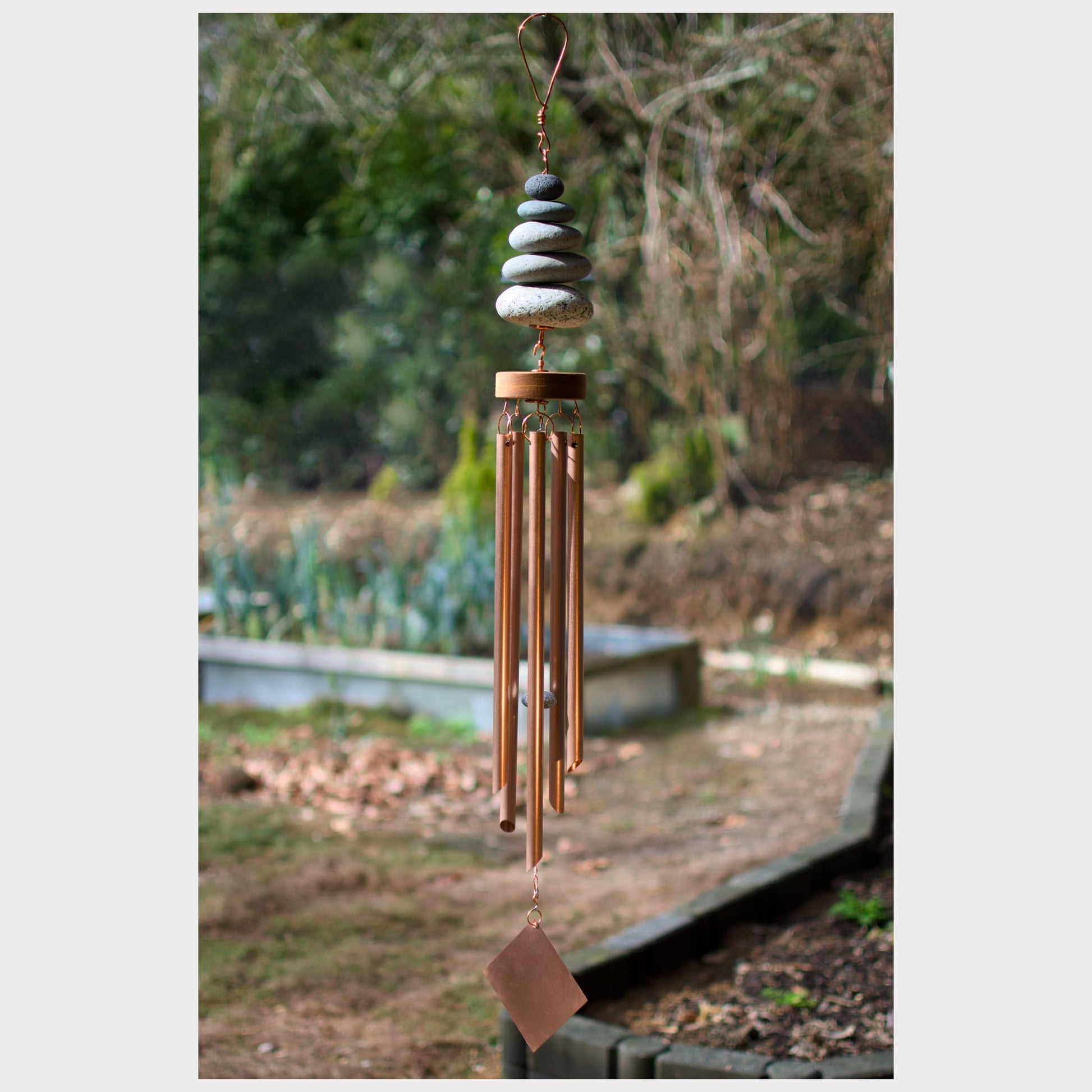 Zen wind chime with five natural beach stones and five genuine copper chimes.