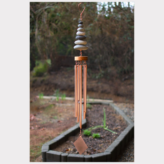 Zen wind chime featuring seven natural beach stones and five genuine copper chimes.