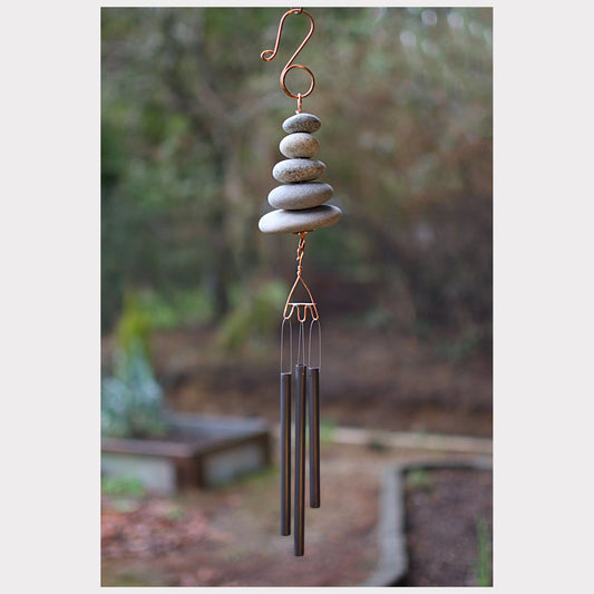 Zen wind chime featuring five natural beach stones and three antiqued chimes.