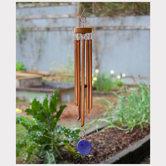 handmade copper wind chime with a blue sea glass windsail.