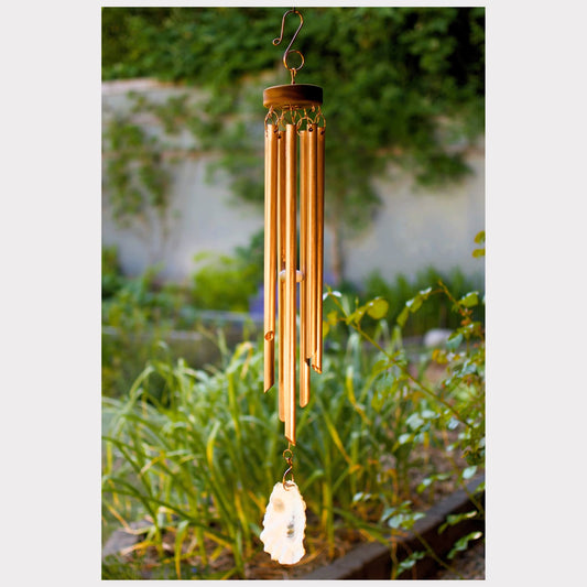Large handcrafted copper wind chime with an oyster shell windsail.