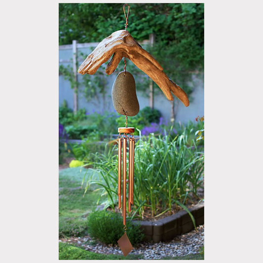 Large driftwood and beach stone wind chime with seven copper chimes.