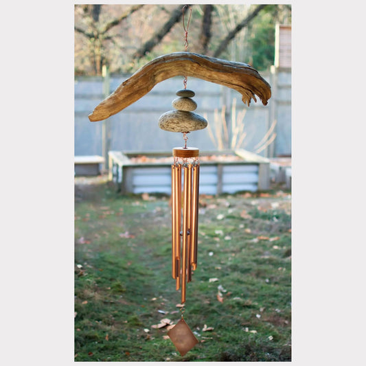 Large natural driftwood beach stone wind chime with seven copper chimes.