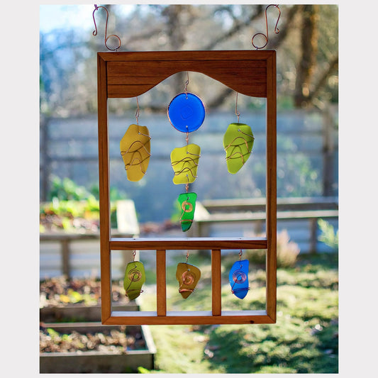 Large framed suncatcher with copper wrapped sea glass.