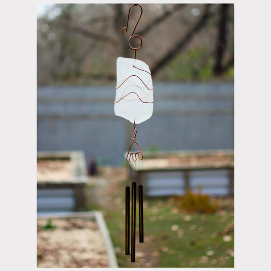 Frosty sea glass wind chime with three brass chimes.