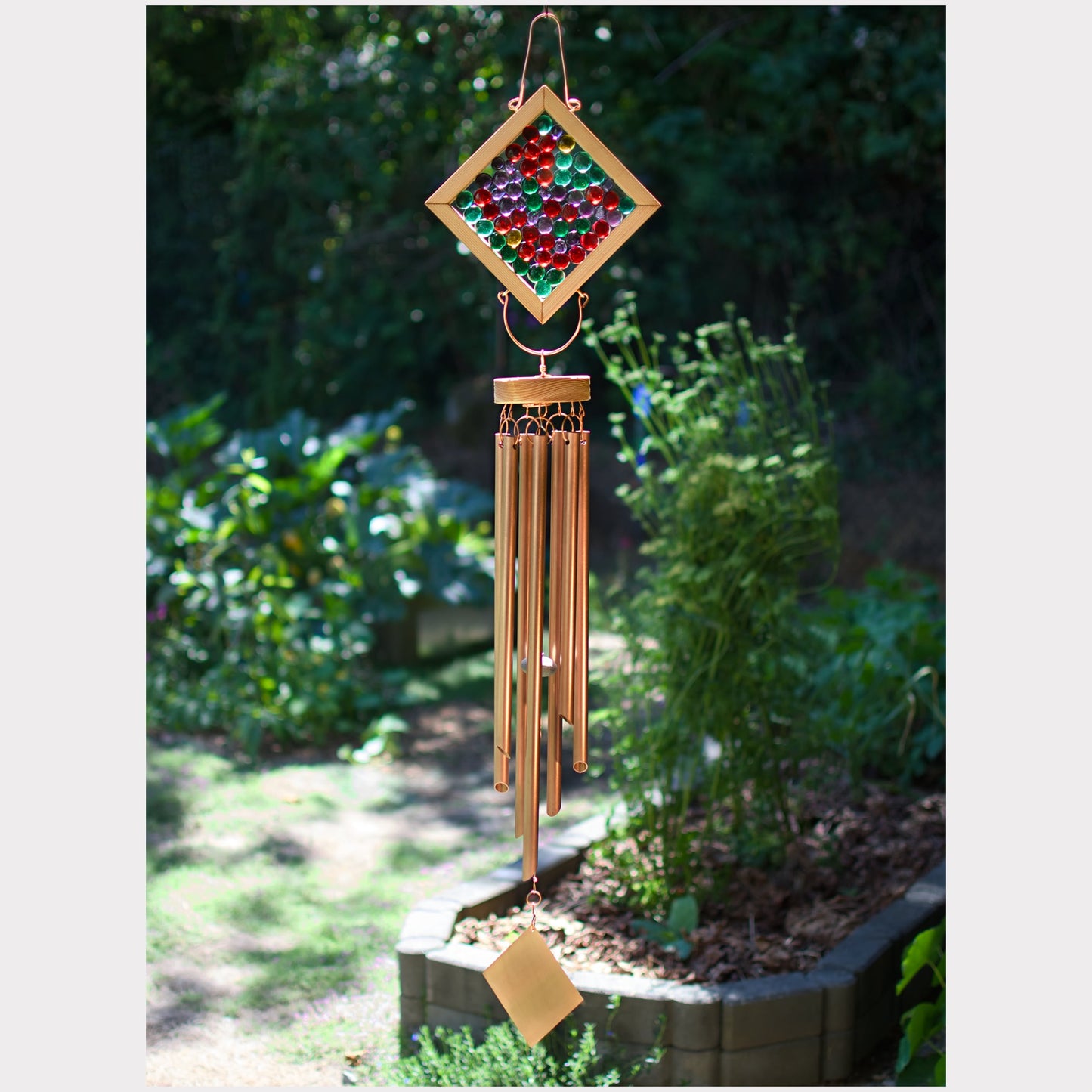 Kaleidoscope wind chime featuring colorful glass and 7 genuine copper chimes.