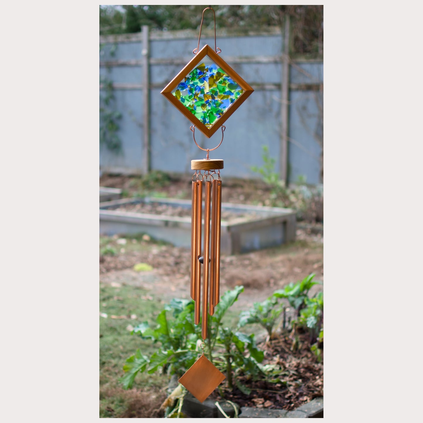 Handcrafted sea glass kaleidoscope wind chime with real copper chimes.