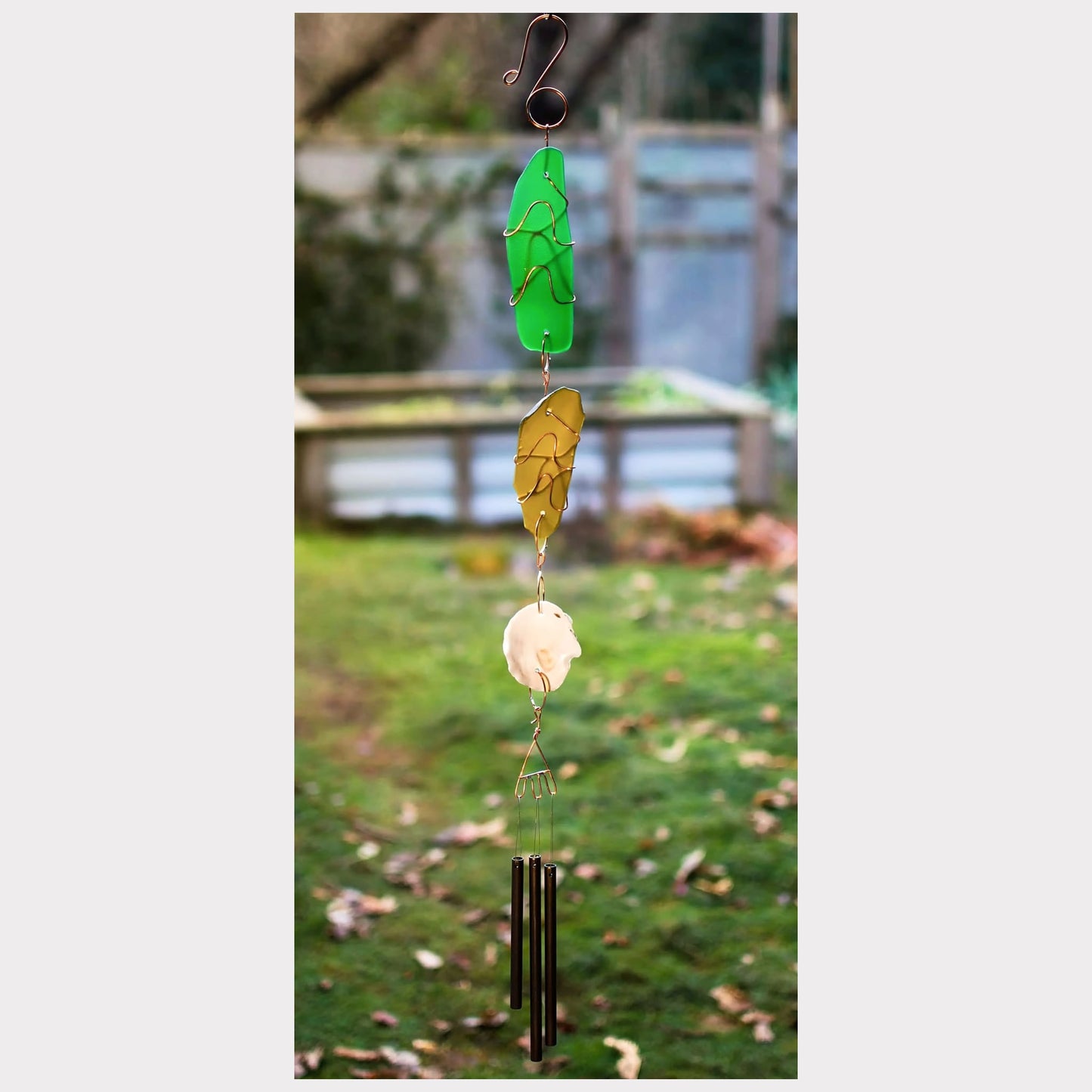 handcrafted sea glass and oyster shell wind chime.