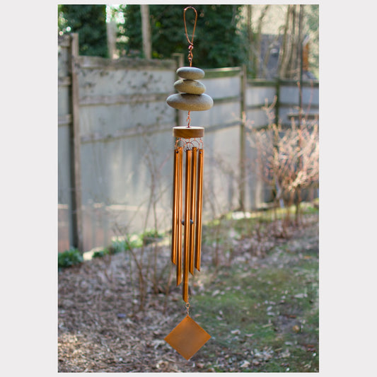 Handcrafted zen beach stone wind chime with copper chimes.