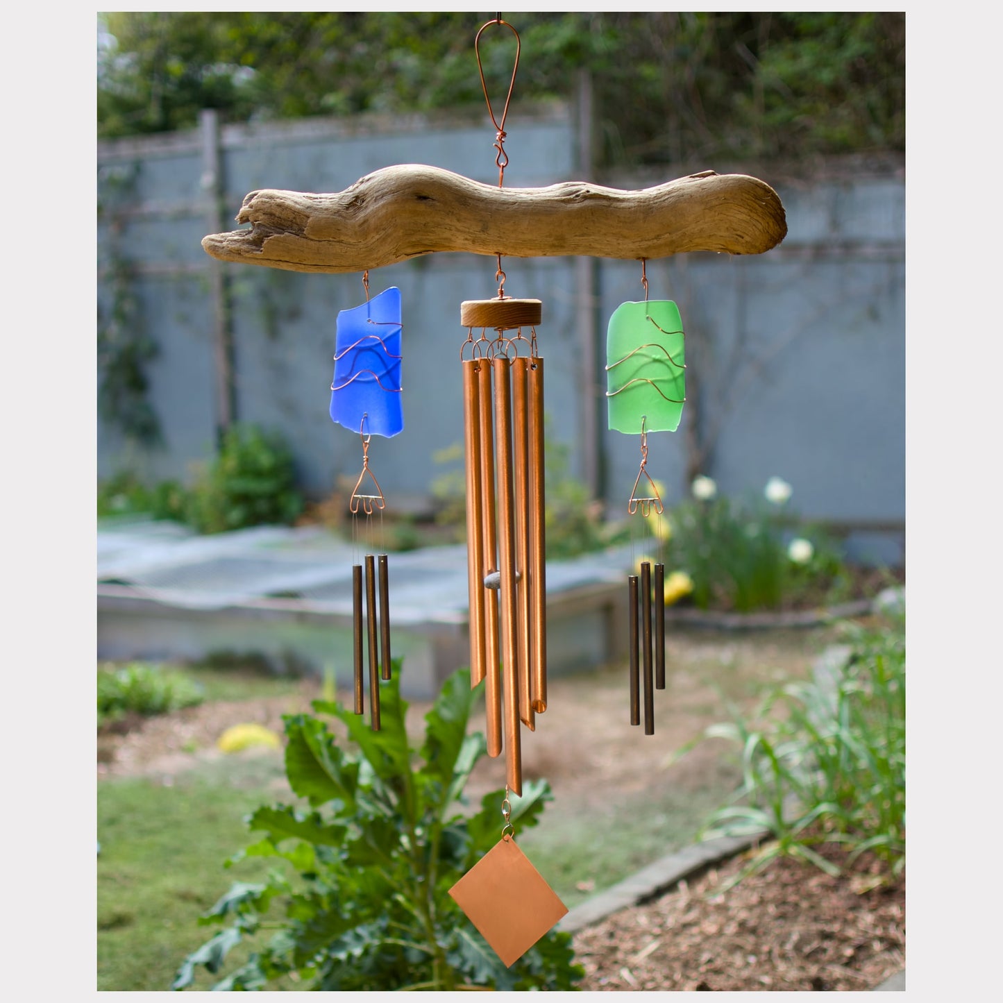 Large sea glass and driftwood triple wind chime, with copper chimes and two sets of brass chimes.
