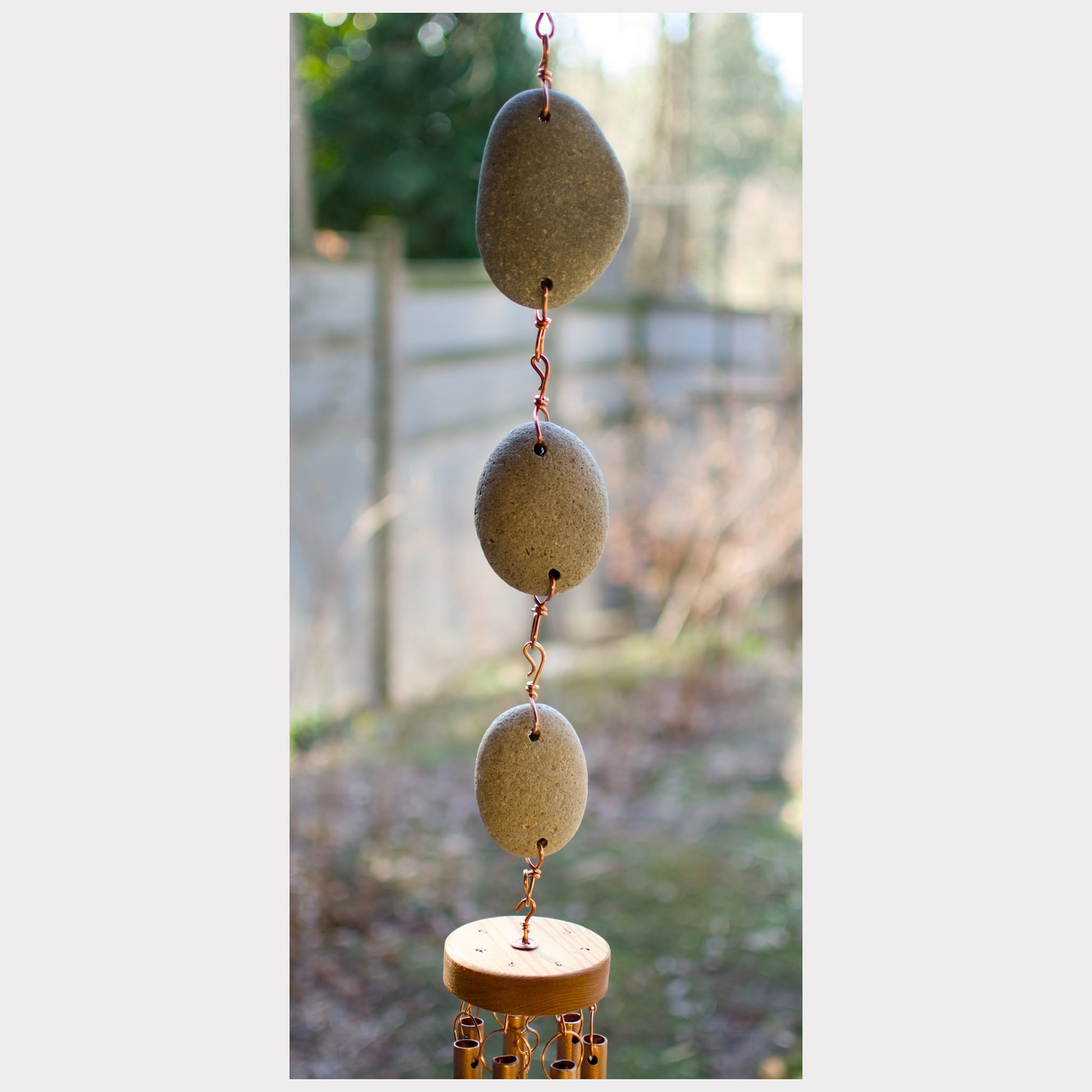 detail of a large beach stone wind chime