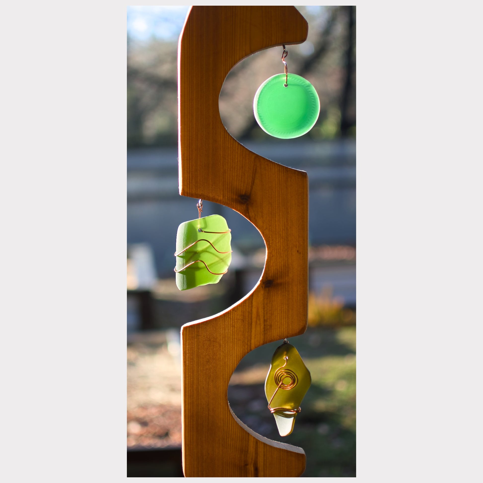 zoom detail cedar and glass wind chime.