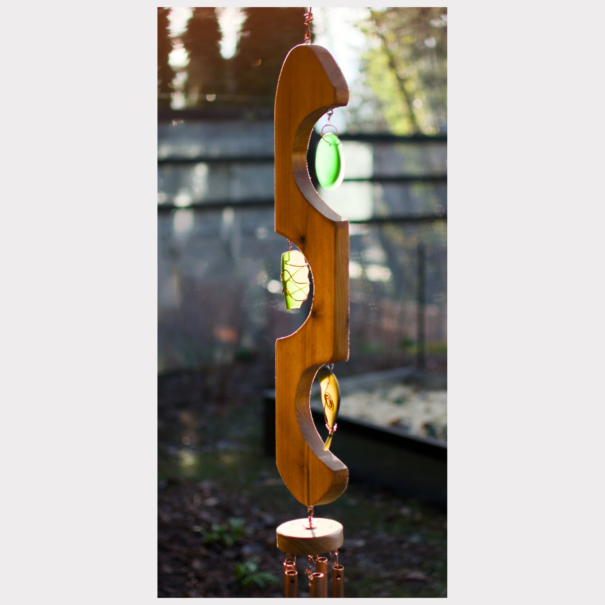 side view, cedar and glass copper wind chime.