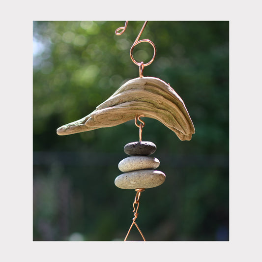 Detail, driftwood and beach stone wind chime.