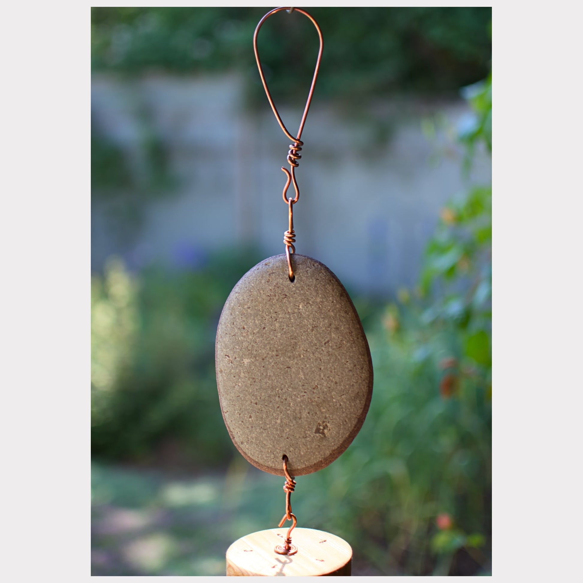 detail, beach stone wind chime