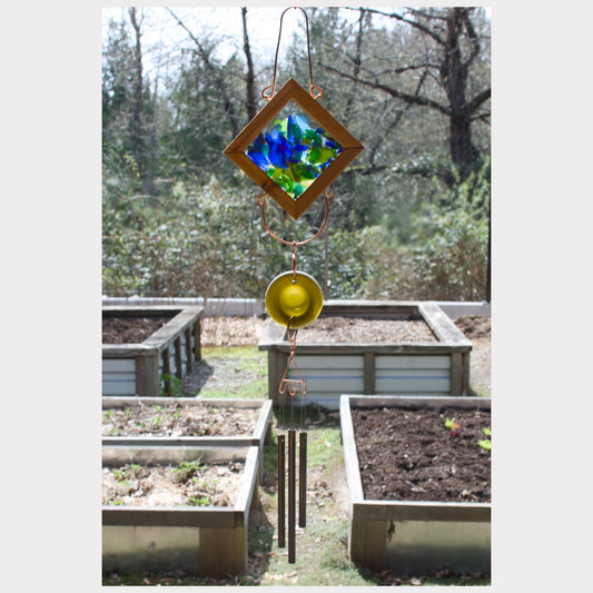 Kaleidoscope wind chime featuring artist-made sea glass and three brass chimes.
