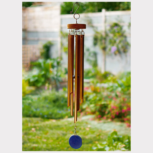 handcrafted copper wind chime with a cobalt blue sea glass windsail.