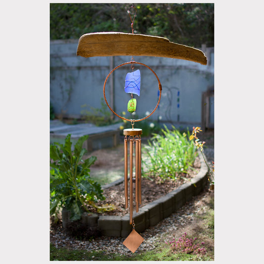 Large driftwood wind chime with copper and sea glass.