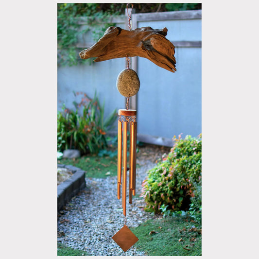 Large handmade driftwood and beach stone wind chime with seven copper chimes.