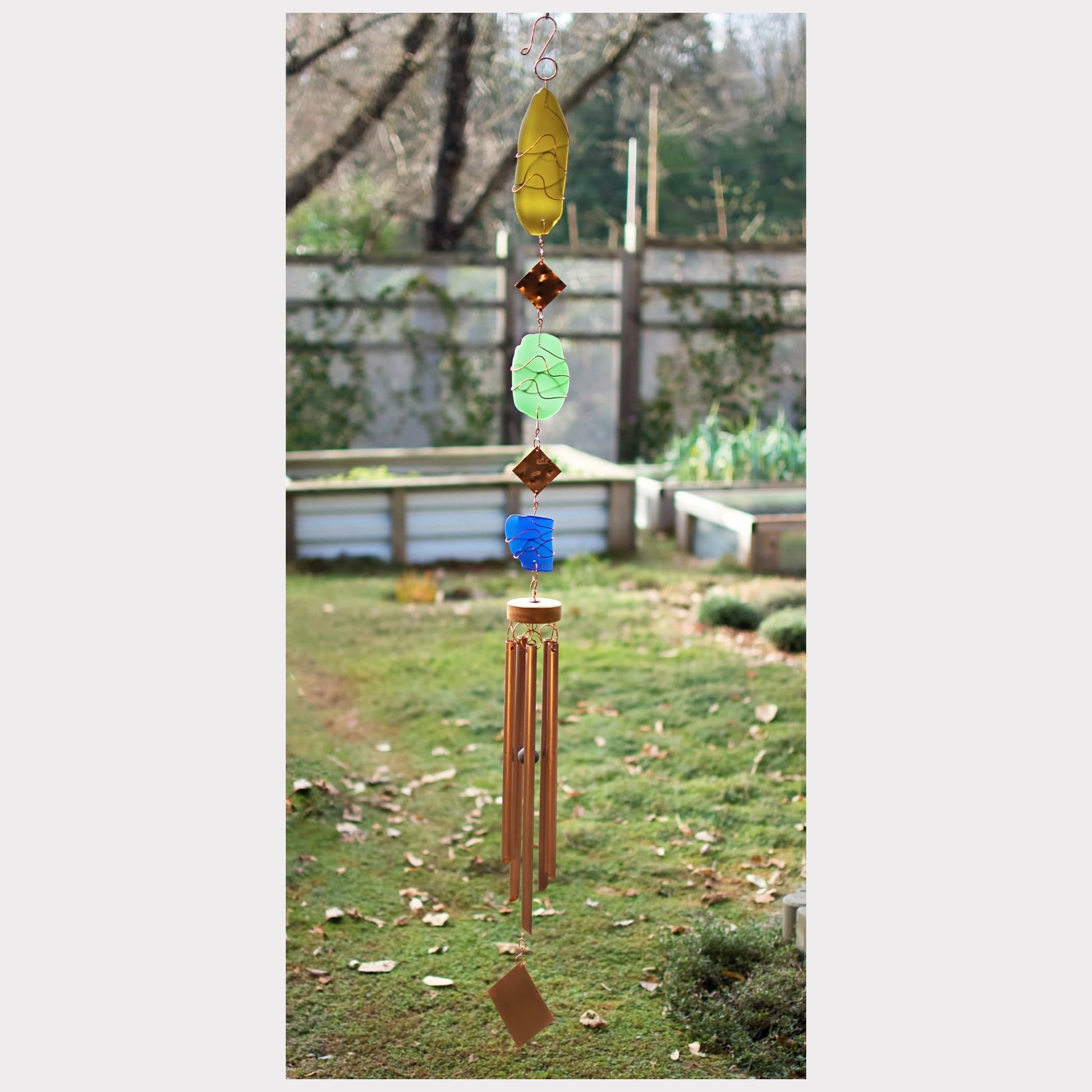 Large handcrafted sea glass wind chime with five copper chimes.