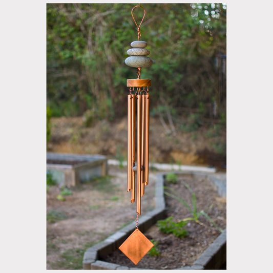 Zen wind chime featuring three natural beach stones and five genuine copper chimes.