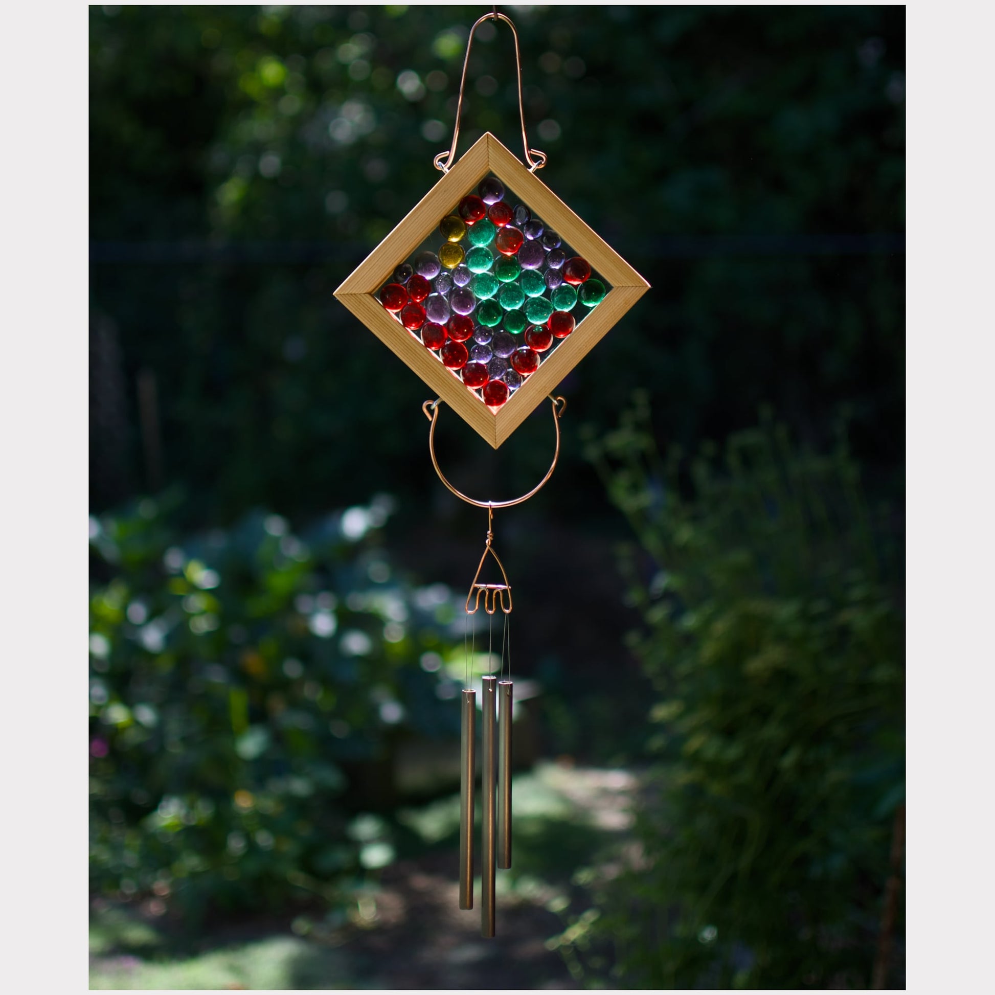 Kaleidoscope wind chime featuring colorful glass and 3 handmade antiqued brass chimes.