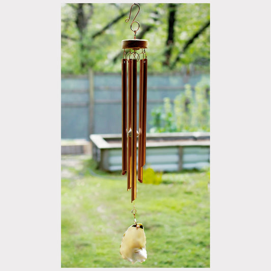 Copper wind chime with an oyster shell windsail.
