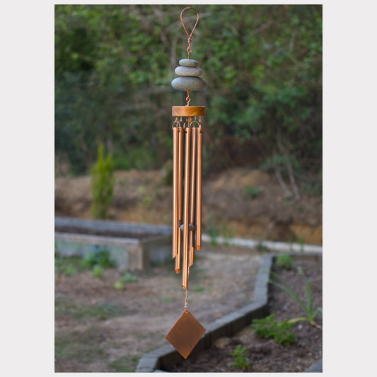 Zen wind chime featuring three natural beach stones and five genuine copper chimes.