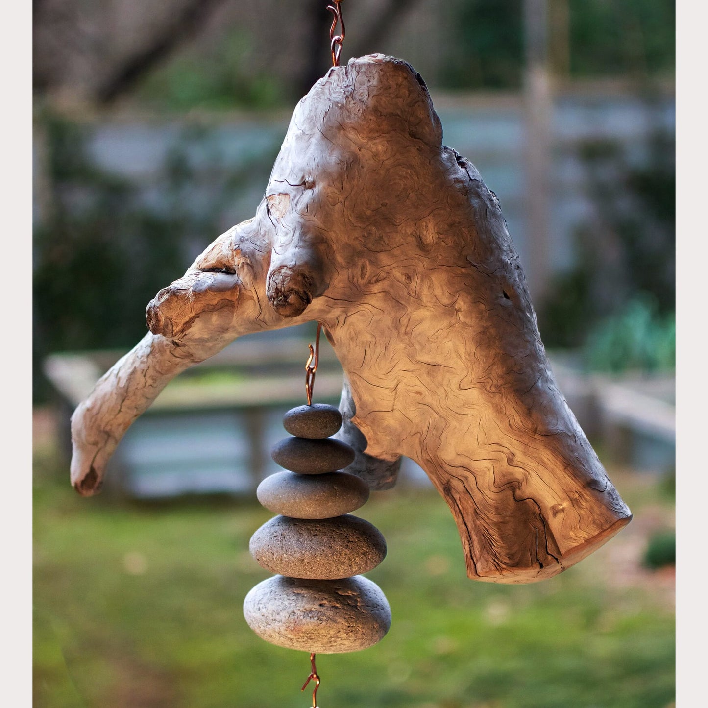 detail large driftwood beach stone wind chime