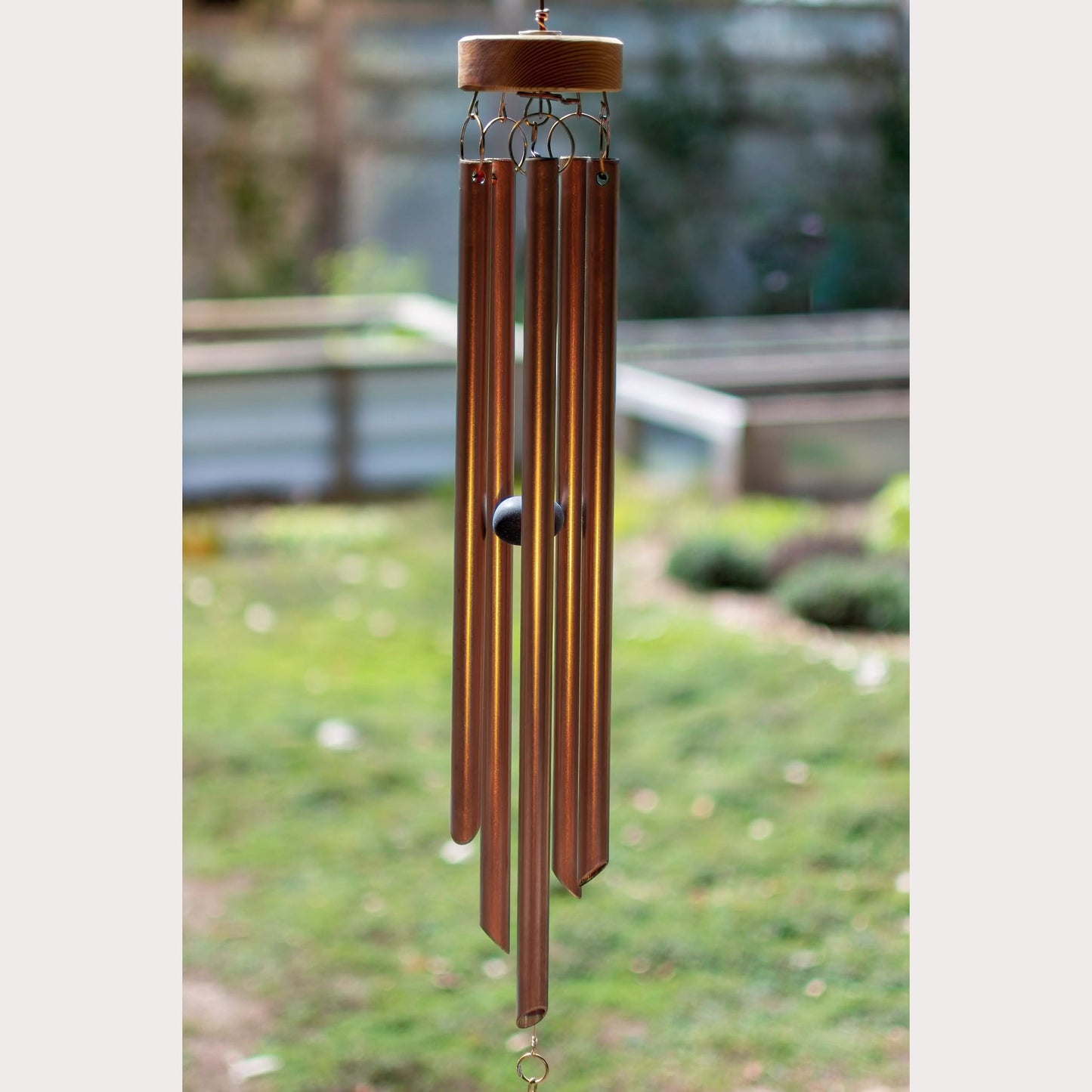 five copper handcrafted chimes.