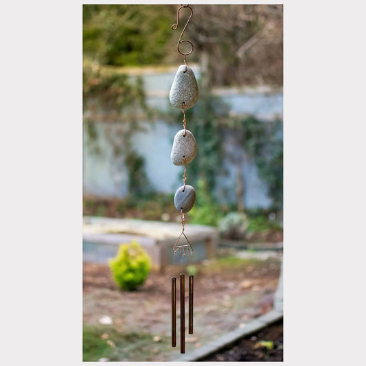 Zen natural outdoor beach stone wind chime with brass chimes.