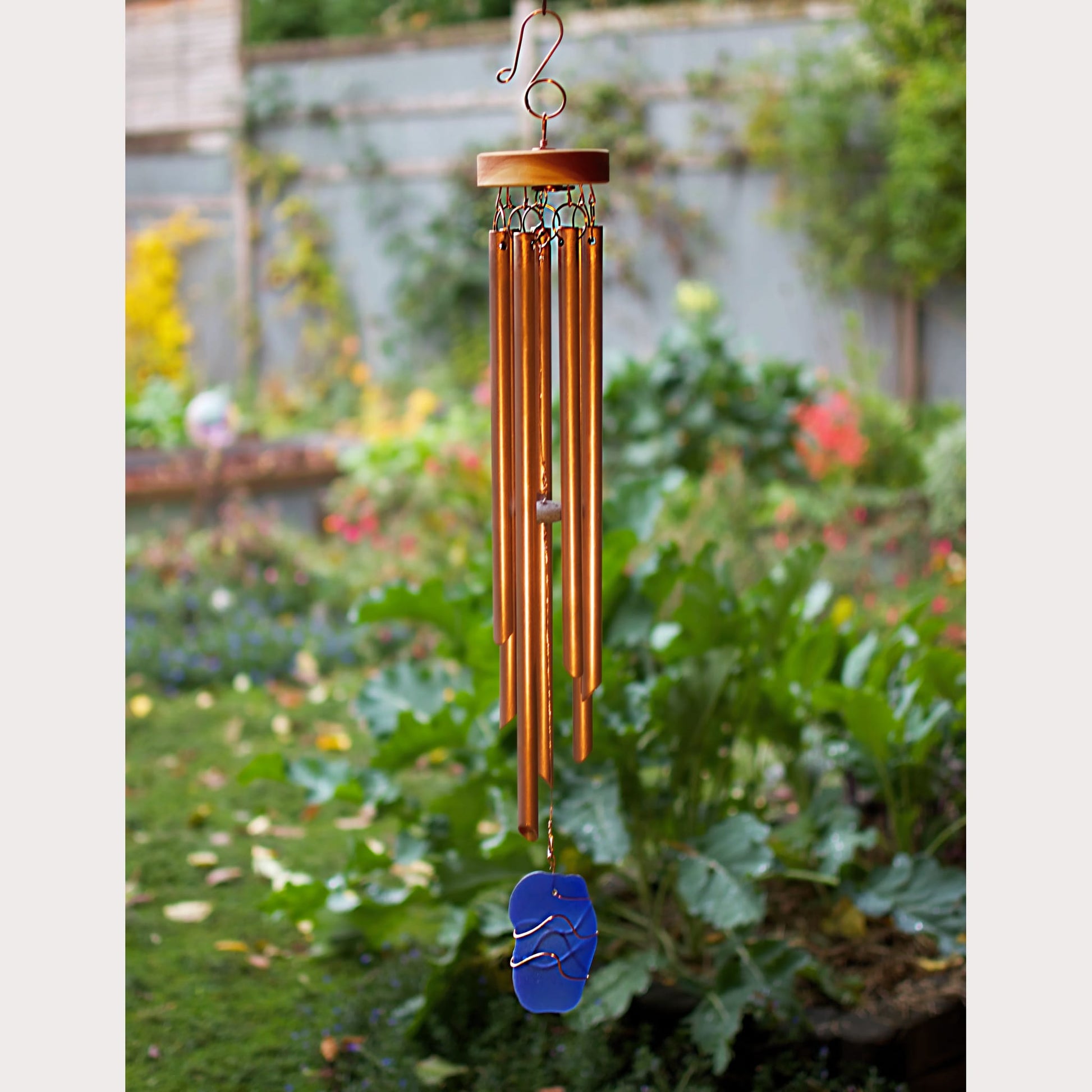 seven copper chimes with blue sea glass windsail